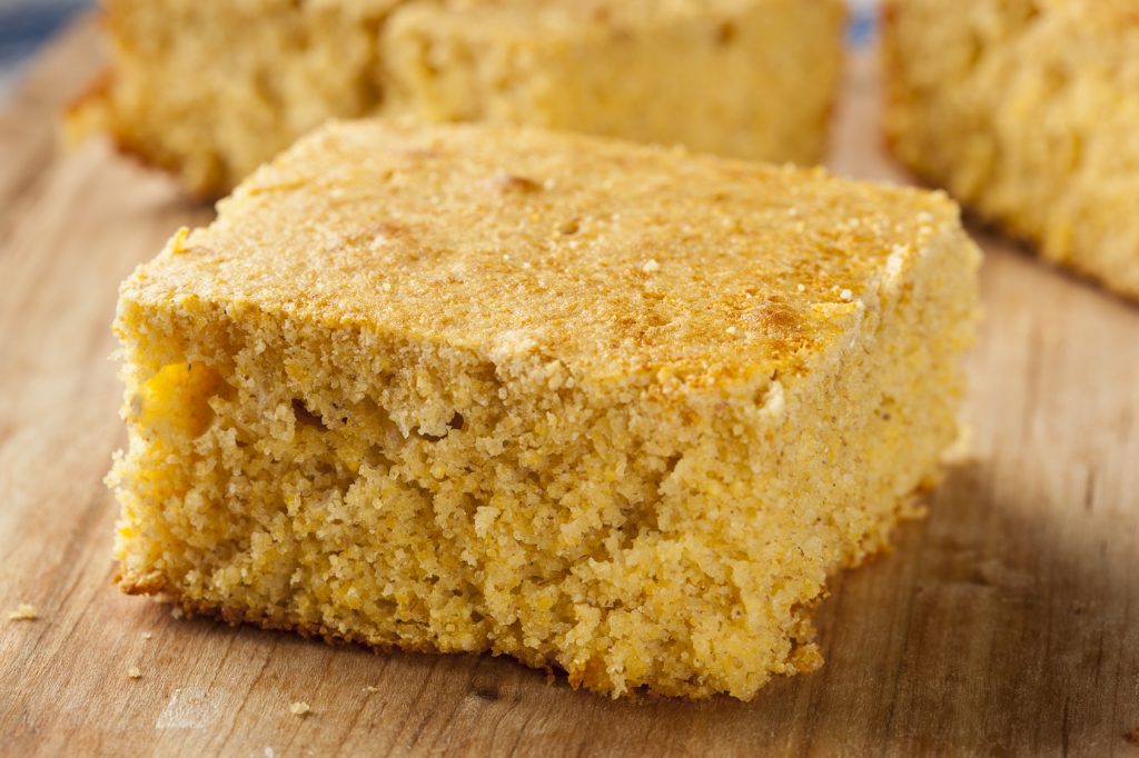 Golden Organic Homemade Cornbread cut into squares